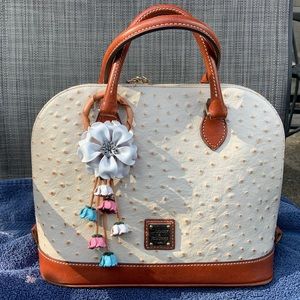 **SOLD** Dooney & Bourke Ostrich Zip Zip with leather flower purse charm.